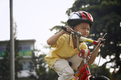 Boy cycling at park