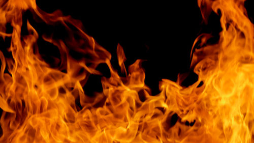 Close-up of bonfire against black background