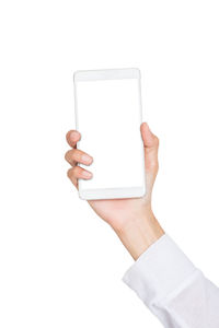 Midsection of man using smart phone against white background