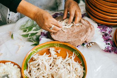 Wrapped with mole from san lucas atzala, puebla with red corn tortilla