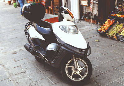 Motor scooter parked on footpath