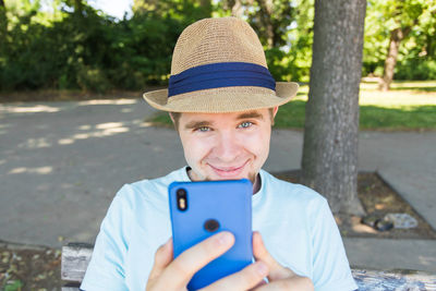 Portrait of mature man using mobile phone