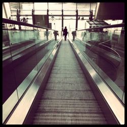 People walking on escalator