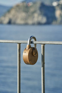 Close-up of padlocks on railing