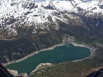 High angle view of lake amidst mountains