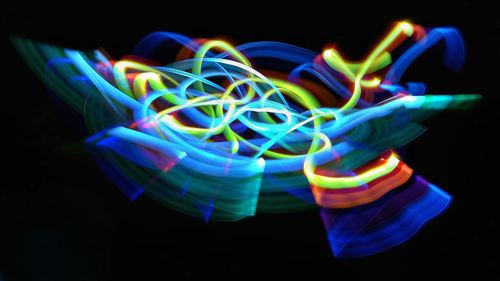 Light trails against black background