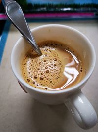 High angle view of coffee cup on table