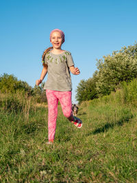 Little girl running smiling playing outdoor family walking spending time together child summer field