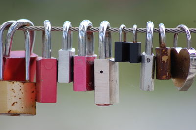 Close-up of padlocks hanging on metal