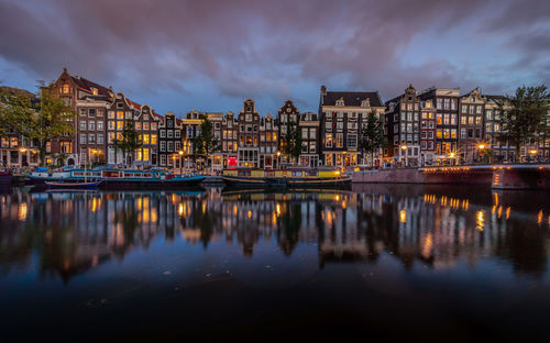 Reflection of buildings in water at night