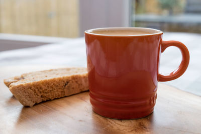 Close-up of biscotti and coffee on table