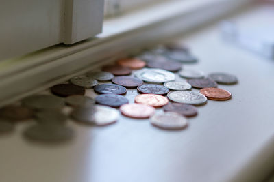 High angle view of coins on table