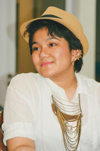 Portrait of young woman looking away