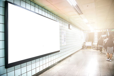 Blank billboard on window at subway station