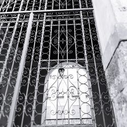 Low angle view of metal grate on window