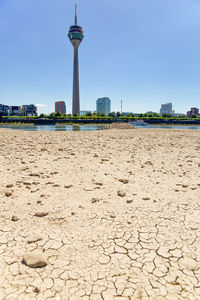 View of beach against buildings in city