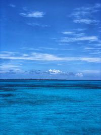 Scenic view of sea against blue sky