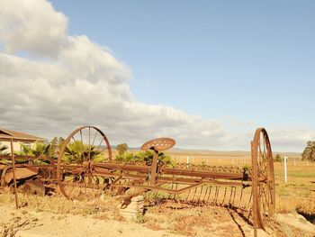 Panoramic view of agricultural field against sky