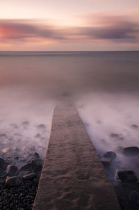 Stone jetty leading into the sea, madeira.