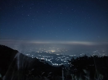 High angle view of illuminated buildings in city at night