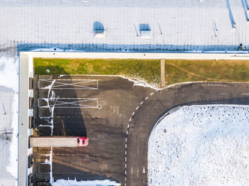 Aerial view of the trucks unloading at the logistic center. drone photography.