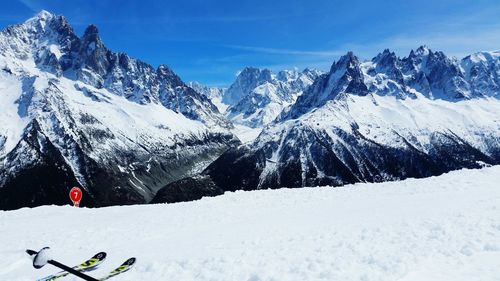 Scenic view of snow covered mountain against sky