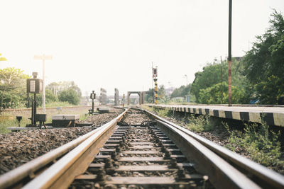 Surface level of railroad tracks against clear sky