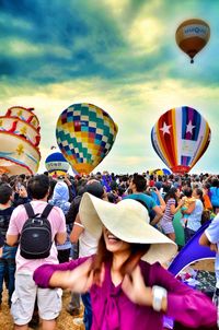 Rear view of people on hot air balloons