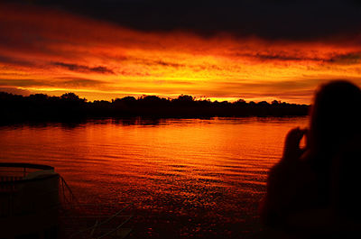 Scenic view of lake against sky during sunset
