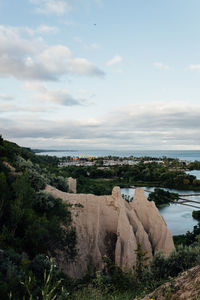 Scenic view of sea against cloudy sky