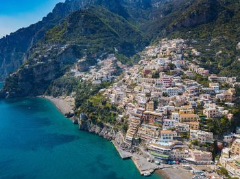 High angle view of townscape by sea