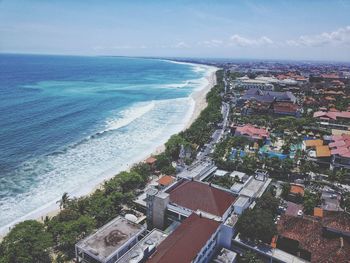 High angle view of sea and buildings against sky