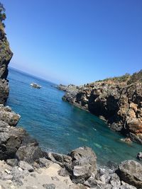 Scenic view of sea against clear blue sky