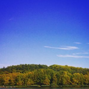 Scenic view of landscape against blue sky