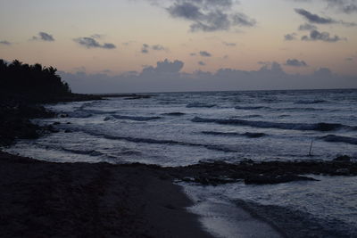 Scenic view of sea against sky at sunset