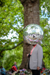 Close-up of crystal ball in forest