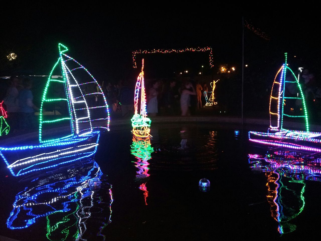 REFLECTION OF ILLUMINATED BUILDINGS IN WATER