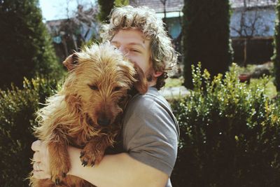 Close-up of man with dog