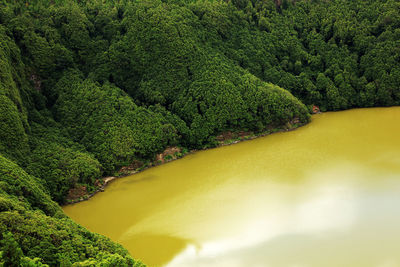 High angle view of lake by tree mountain at azores