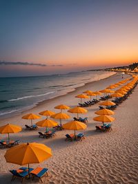 Scenic view of beach against sky during sunset