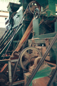 Close-up of rusty machine part in factory