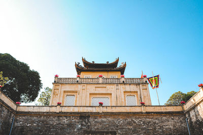 Low angle view of temple building against clear sky