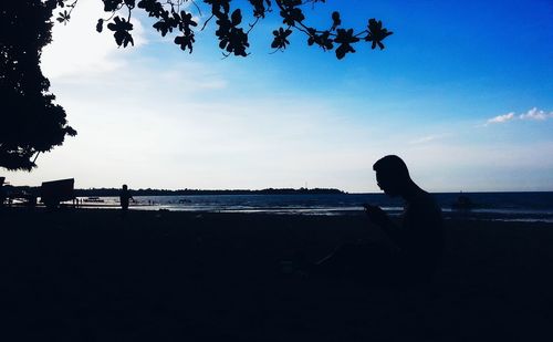 Silhouette of people on beach