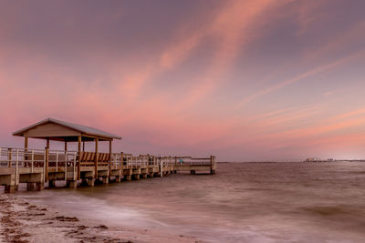 Pier over sea against sky