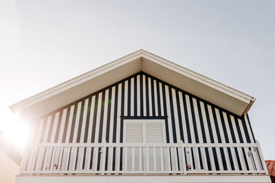 Colorful striped wooden beach houses at the promenade of costa nova, aveiro, portugal