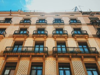 Low angle view of residential building on sunny day