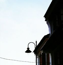 Low angle view of bell tower against clear sky