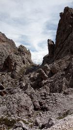 Low angle view of rock formations against sky