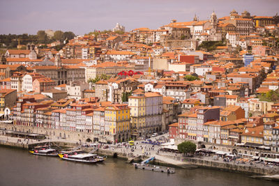 High angle view of residential buildings by river