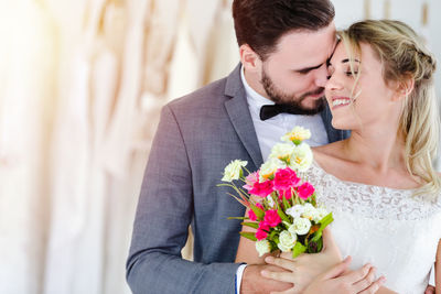 Young couple kissing on flower head